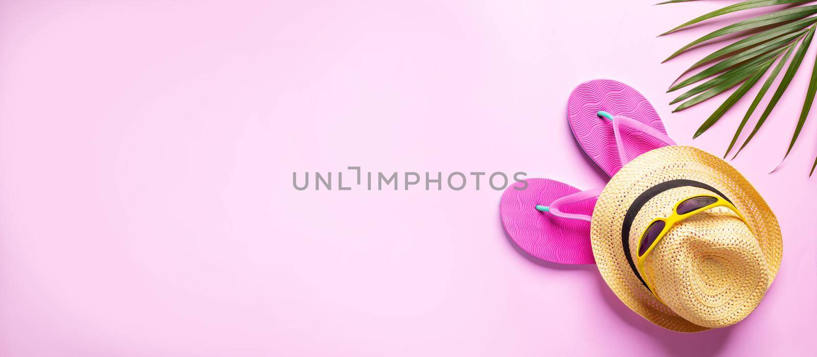 Summer hat with flip flop on pink background by Wasant