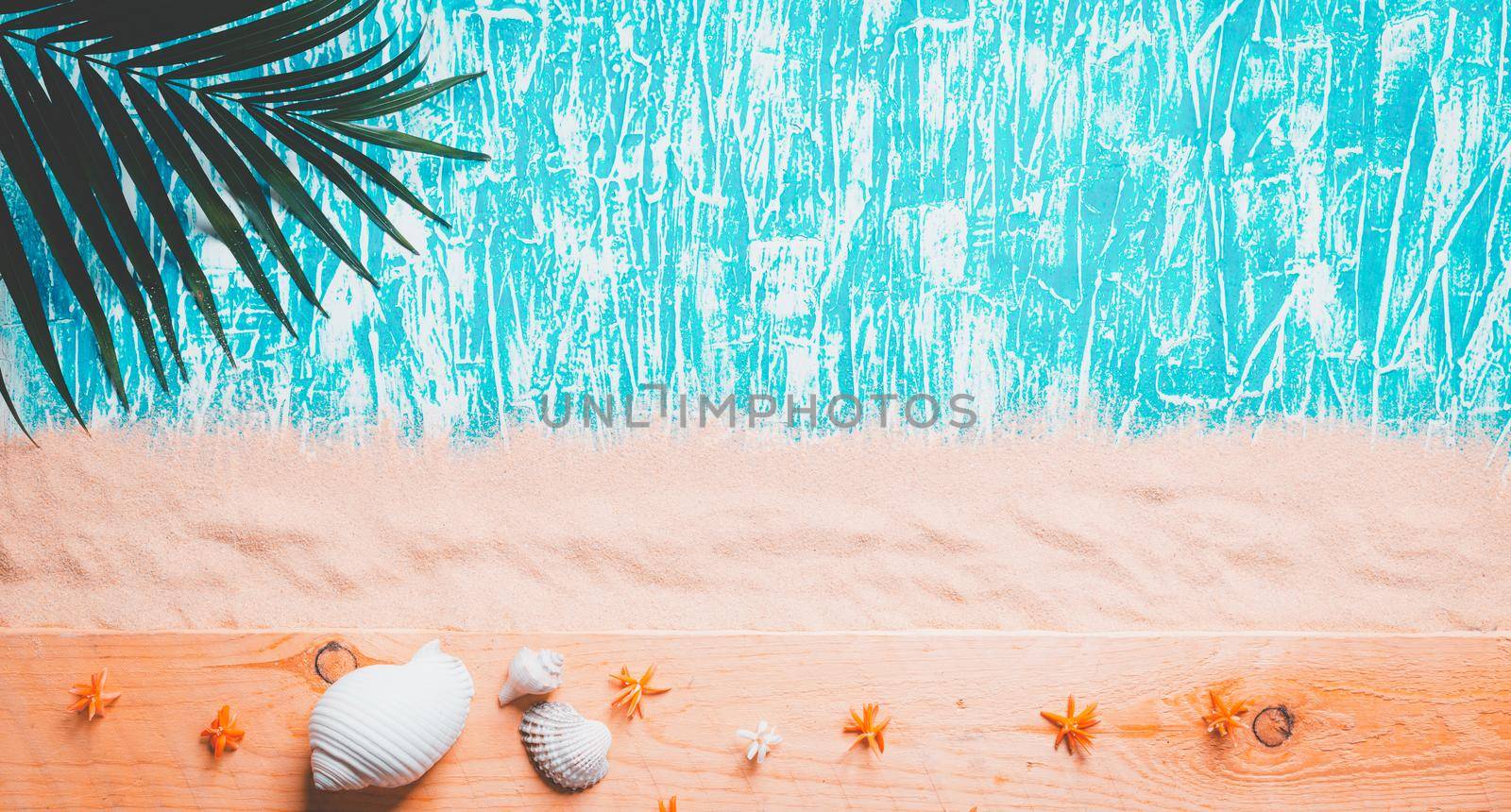 Summer background , Palm branch on sea sand background, space for text