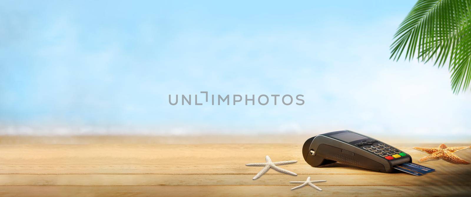 Travel concept. Credit card with beach on landscape blurred background
