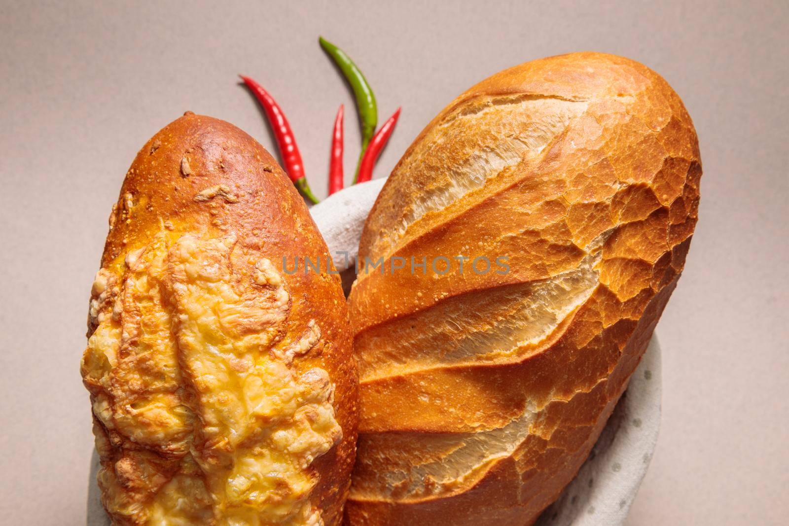 Close-up of fresh bread with pepper and tomato. Fresh bakery. Fried crust