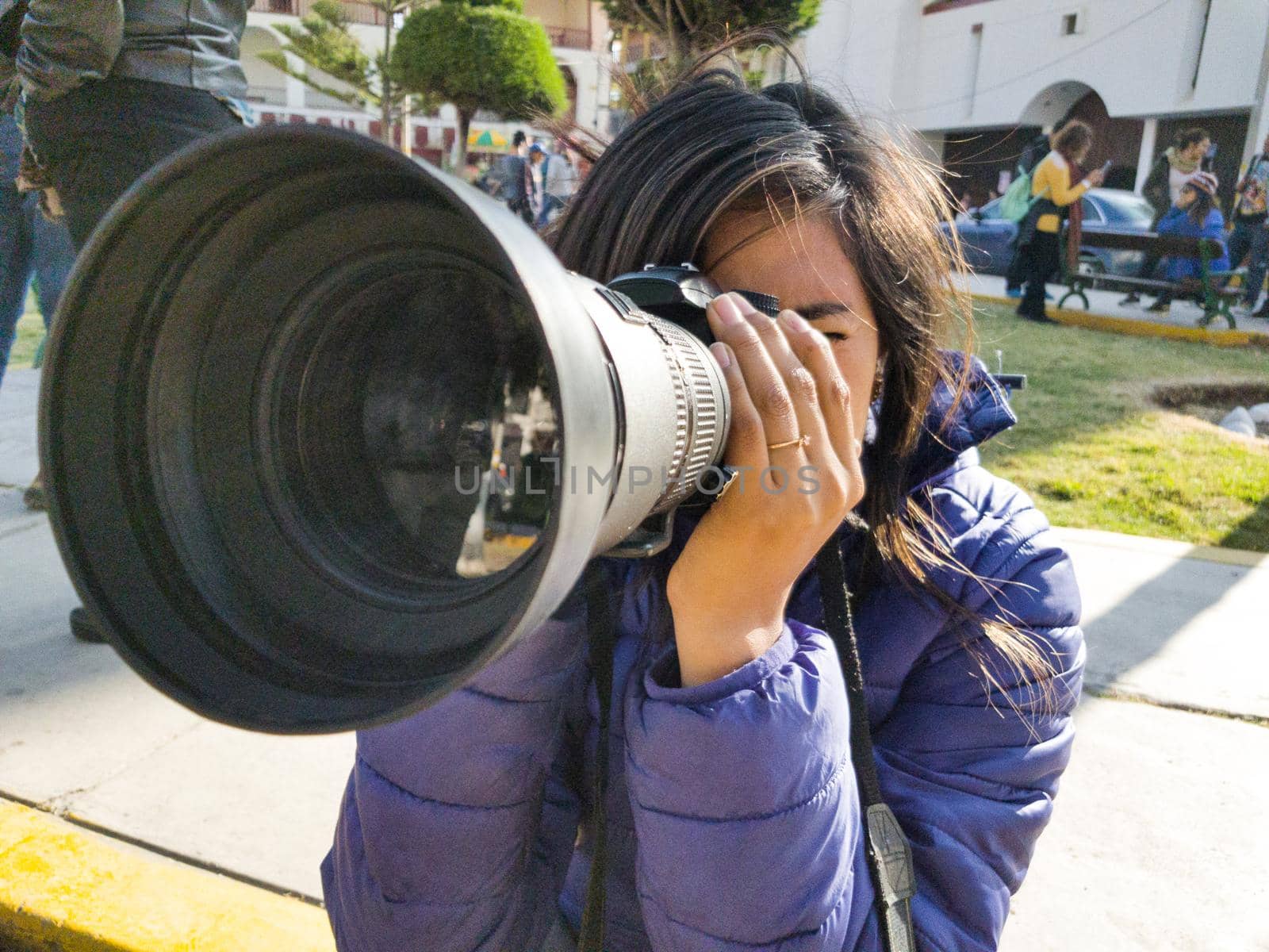 Traveling woman is a professional photographer with dslr camera