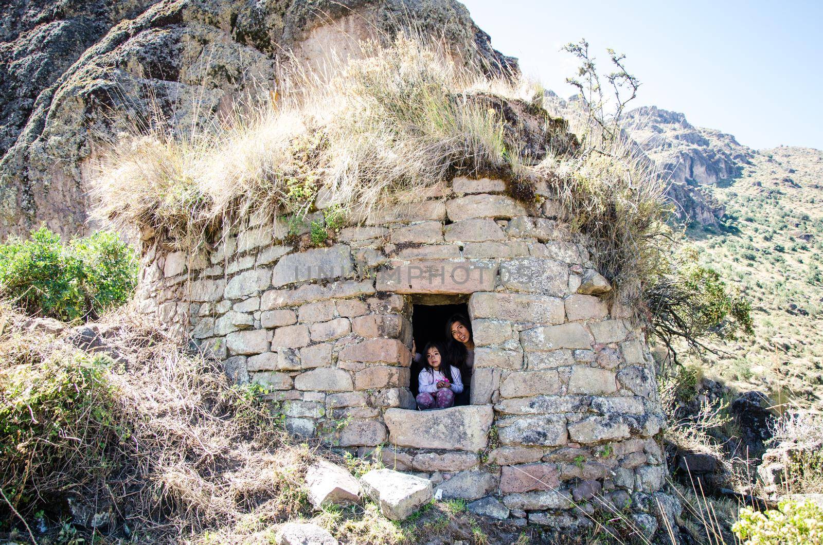 Girl and mom tourist making walks at the funerals of pumacoto in Canta - Peru