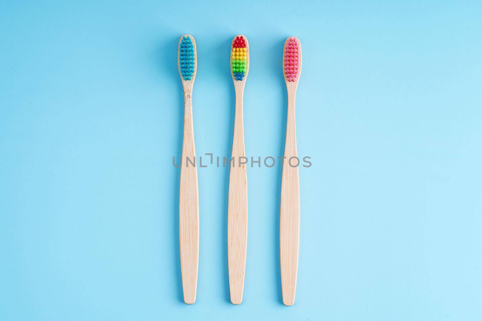 A bunch of eco-friendly bamboo toothbrushes. Global environmental trends. Gender and racial inequality. Toothbrushes of different genders by Try_my_best
