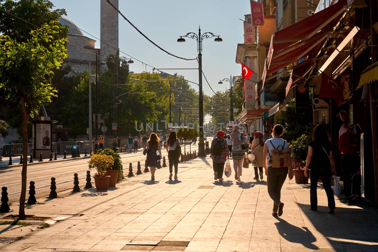 People walk along the sidewalk at Sultanahmet Square in Istanbul by Try_my_best