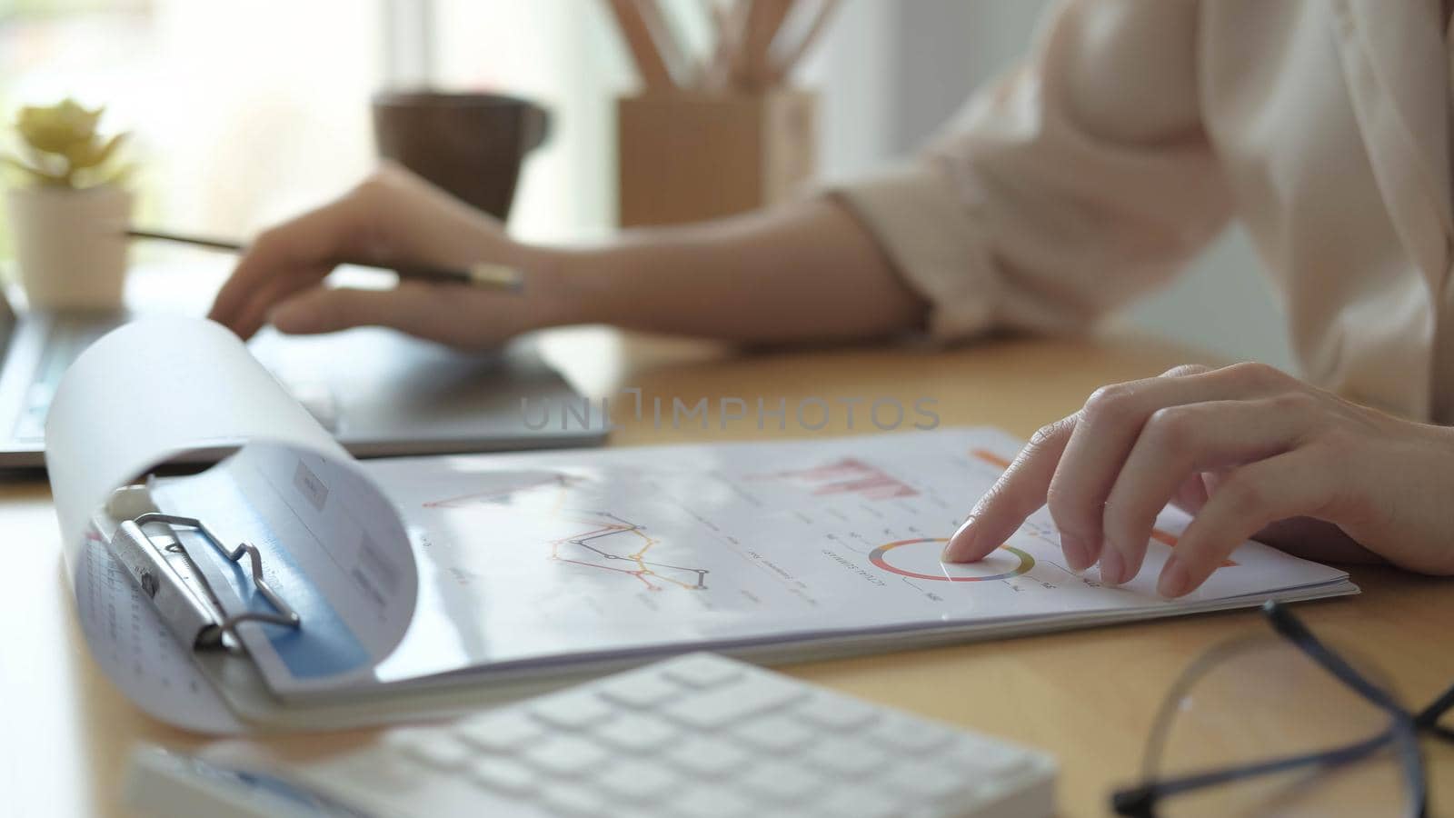 Business woman investment consultant analyzing company annual financial report balance sheet statement working with documents graphs. Concept picture of business, market, office, tax. work form home
