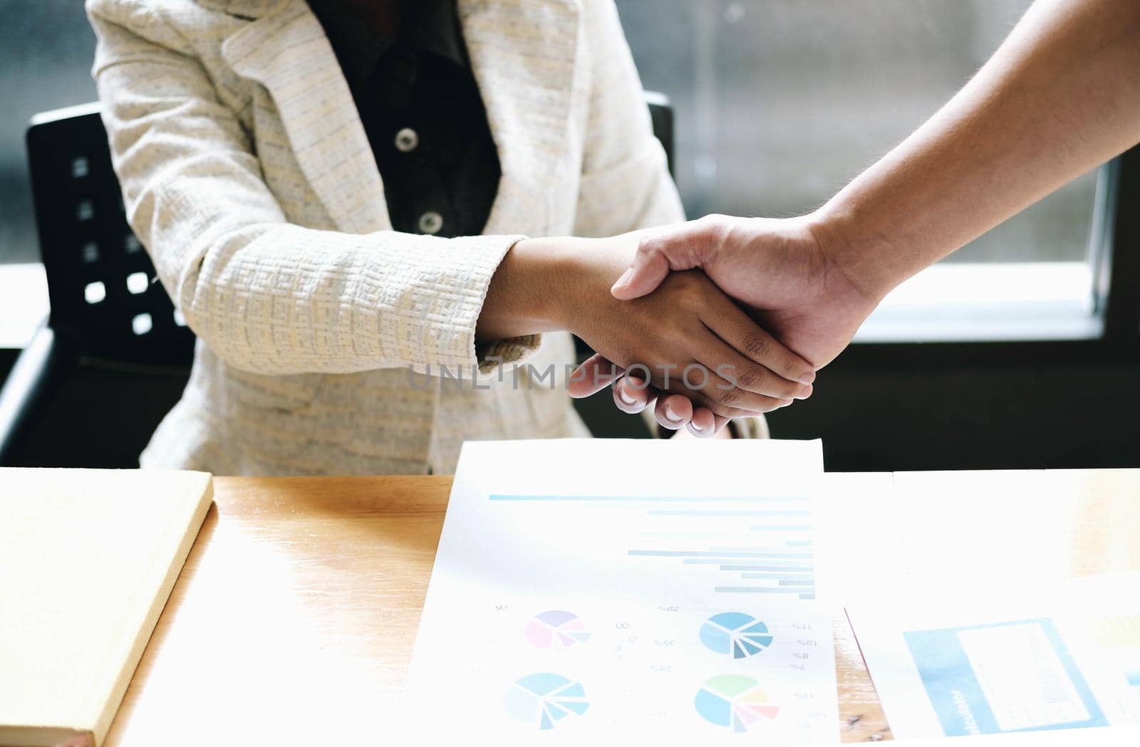 Image of Successful businessmen partnership handshaking after acquisition. Meeting for sign contracts and Group support concept.
