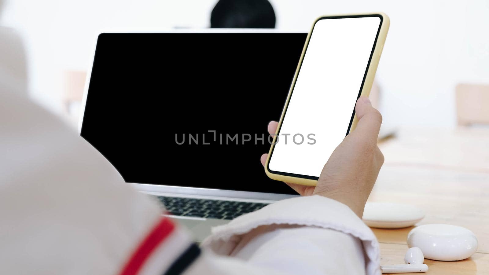 Close-up Of A Woman's Hand Holding Cell Phone With White Blank Screen
