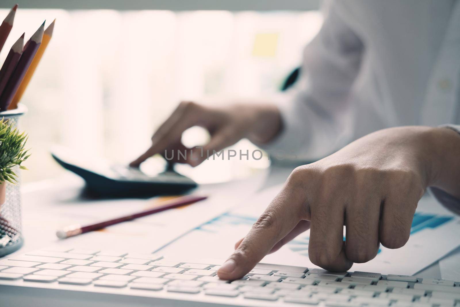 Close up view of bookkeeper or financial inspector hands making report, calculating or checking balance. Home finances, investment, economy, saving money or insurance concept
