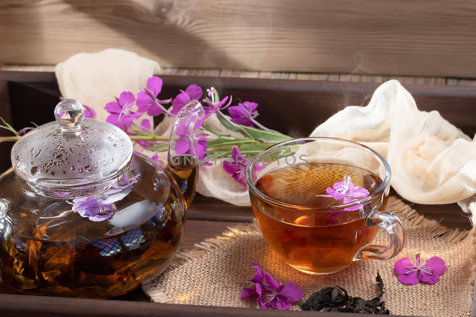 Herbal tea made from fireweed known as blooming sally in teapot and cup.