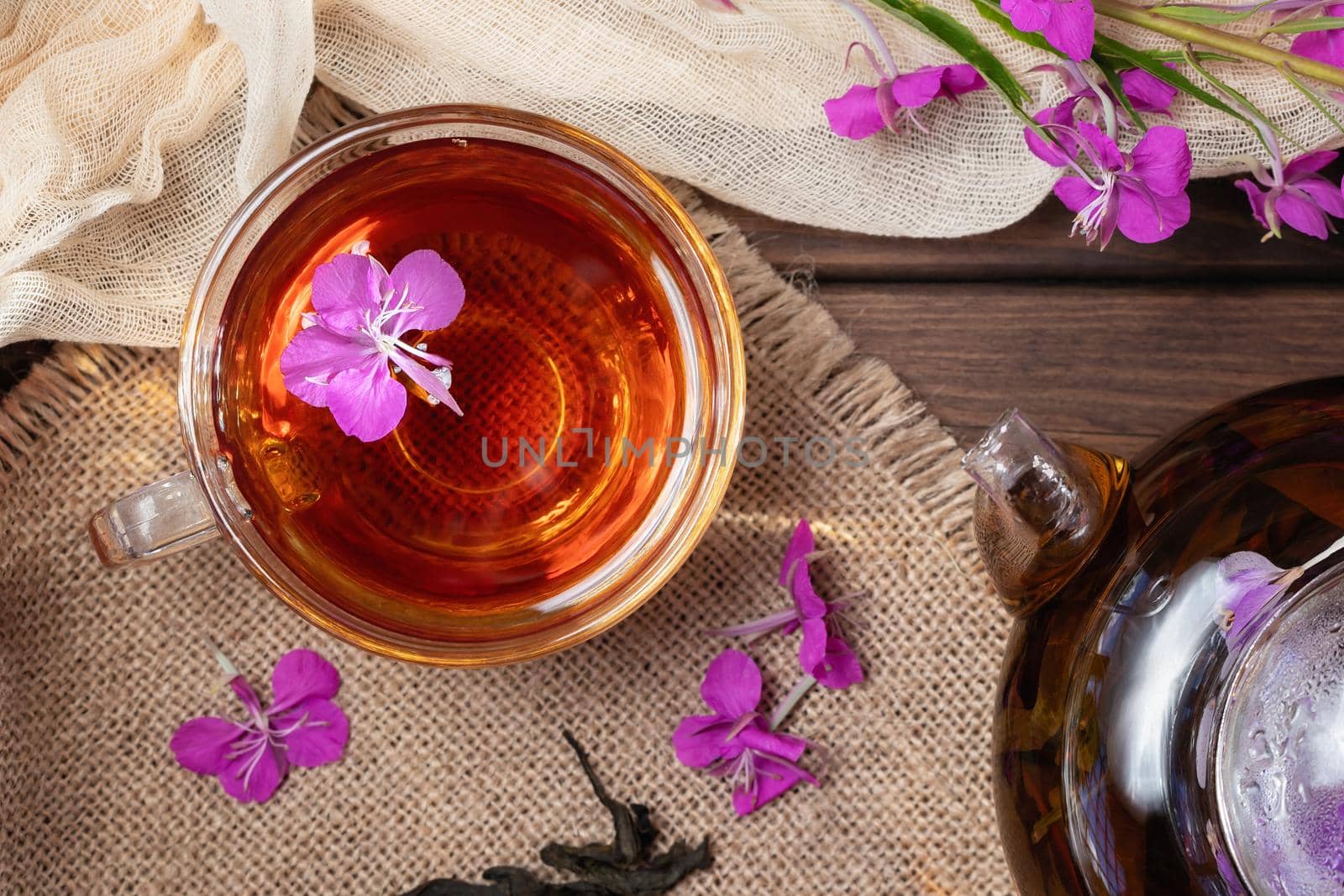 Herbal tea made from fireweed known as blooming sally in teapot and cup, top view by galsand