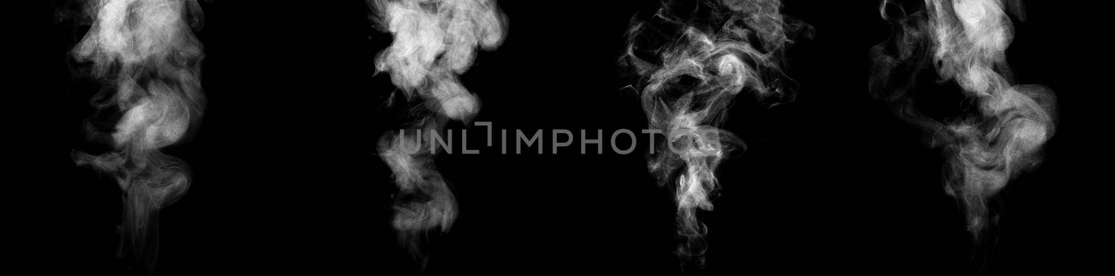 Set of streams of steam isolated on black background.