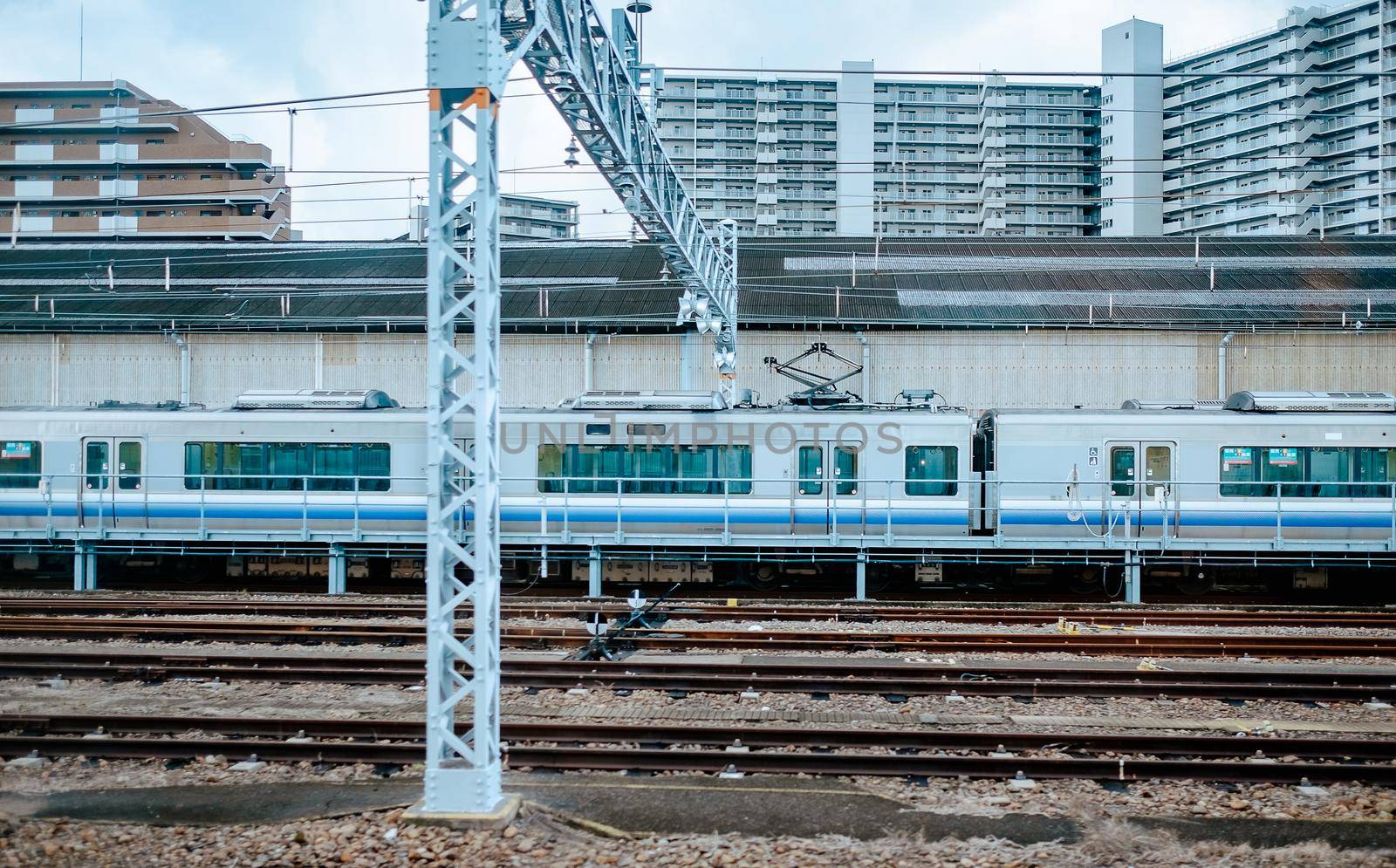 White monorail train is parking in station. by Benzoix