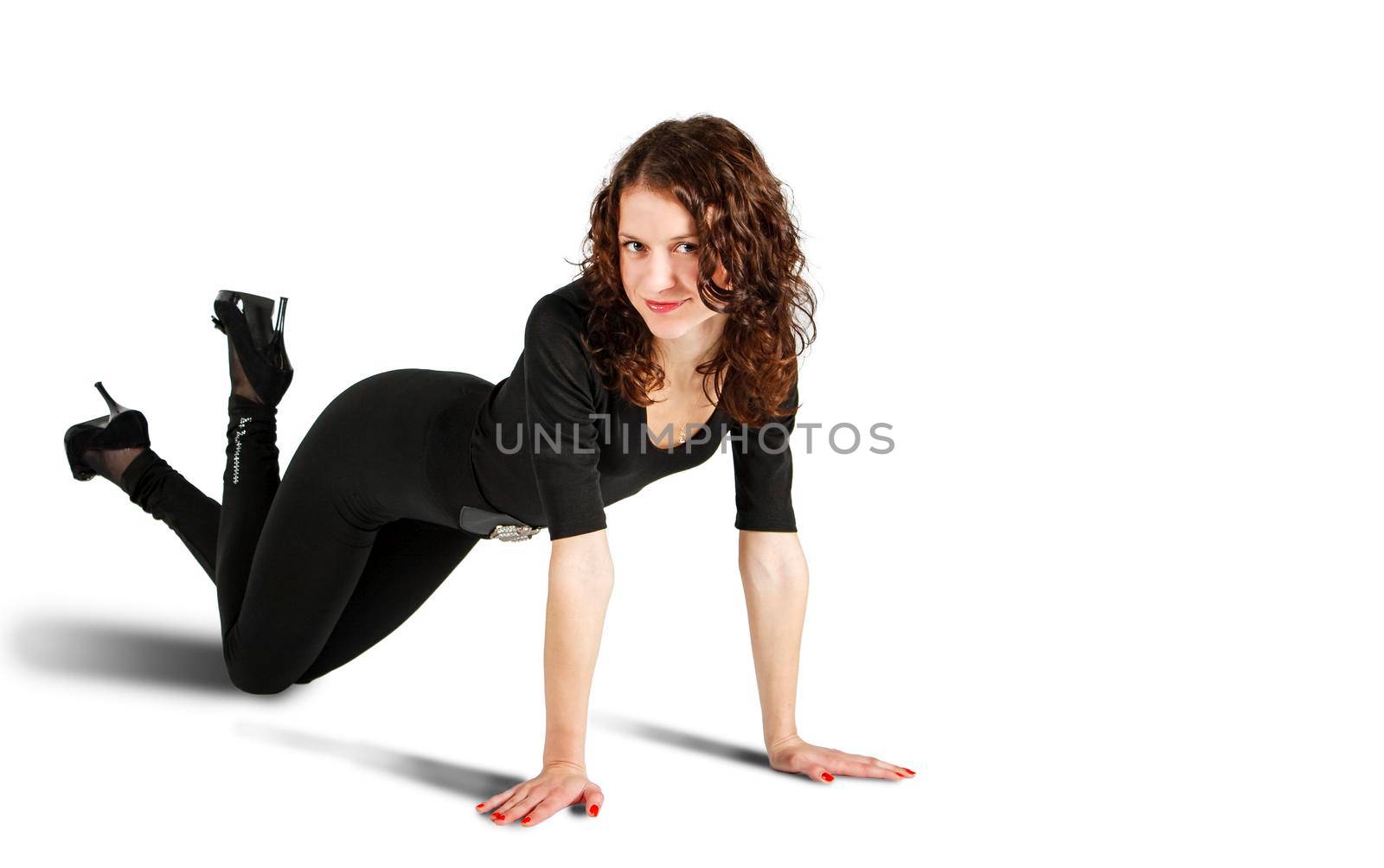 young beautiful woman in black suit posing standing on all fours in the studio on white background