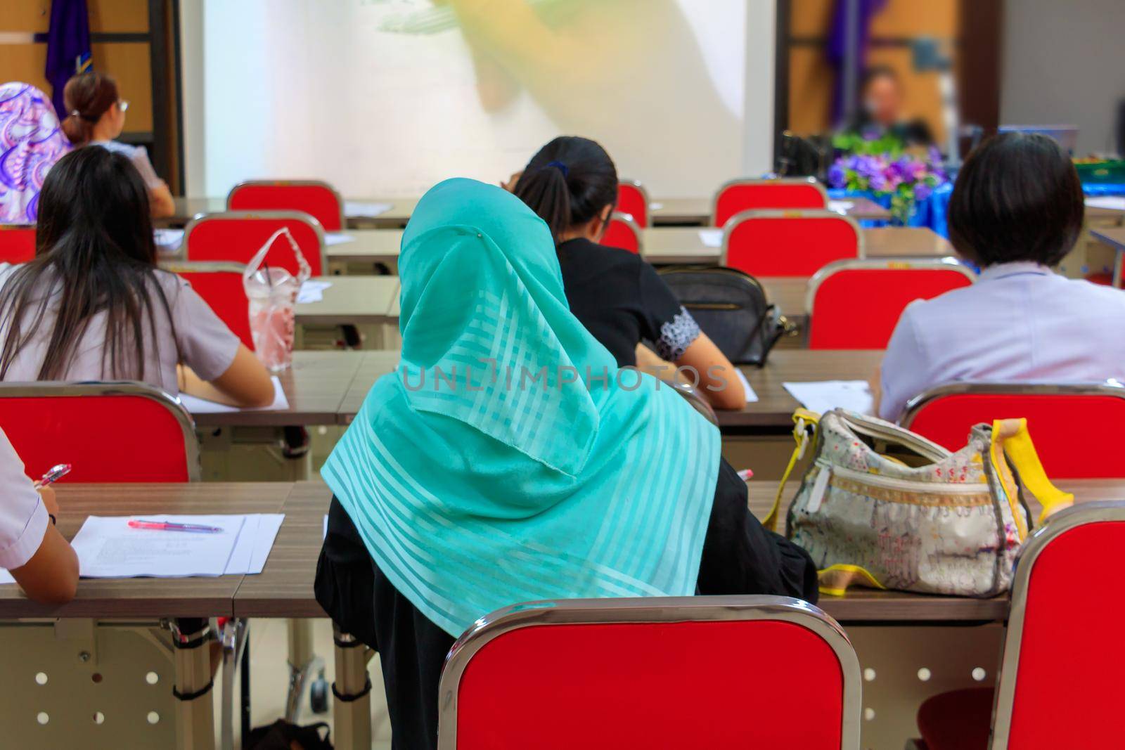 Muslim businesswoman in education seminar training conference in interior  meeting room