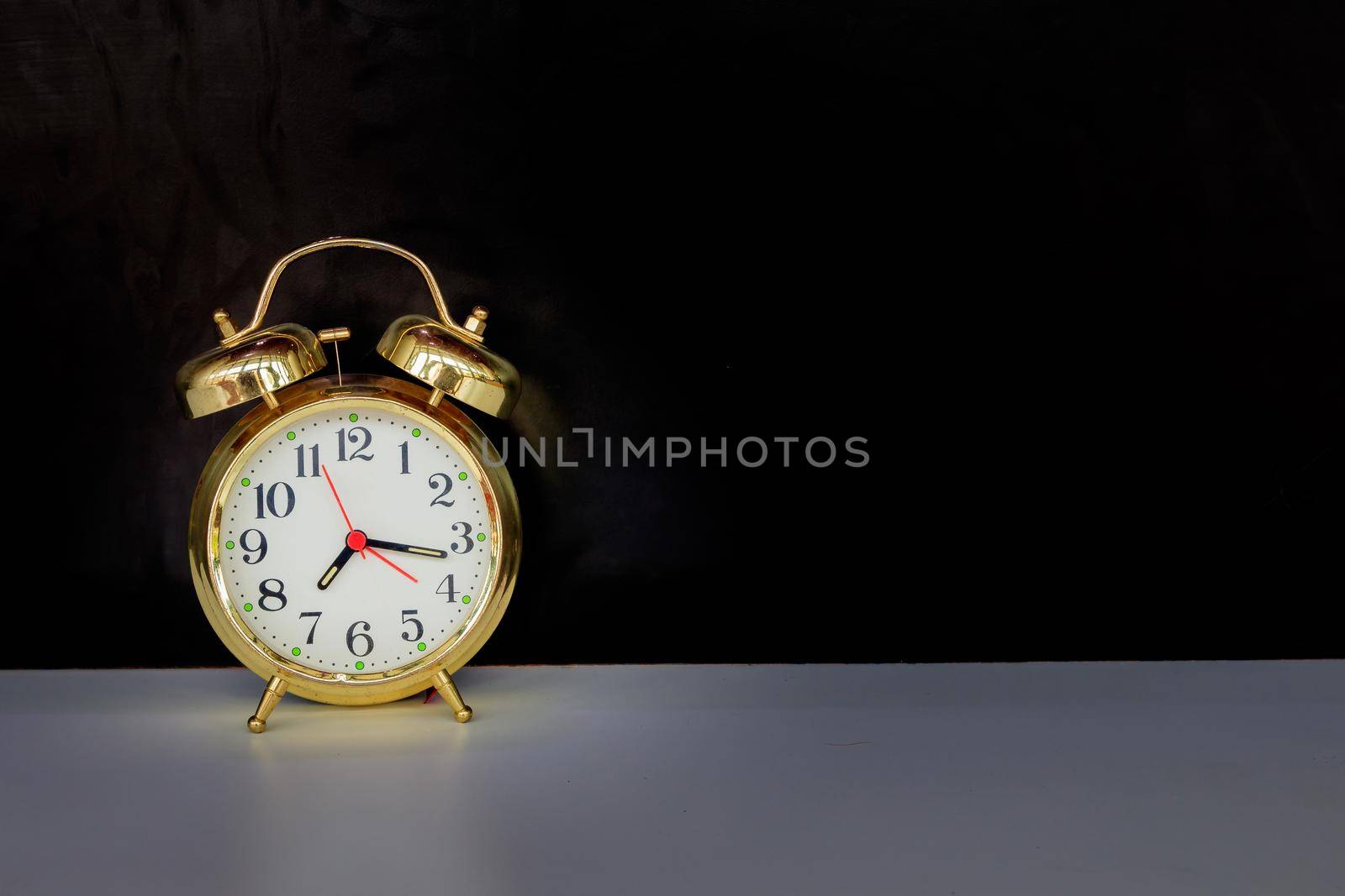 alarm clock old vintage gold on white and black background with copy space add text retro style