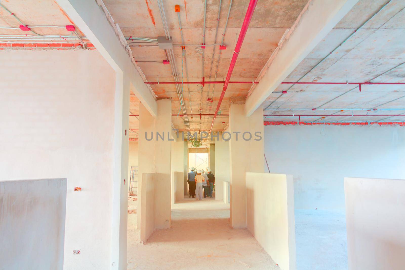 interior in construction and wall decoration at building site with engineer motion and tone light sunlight  morning by pramot