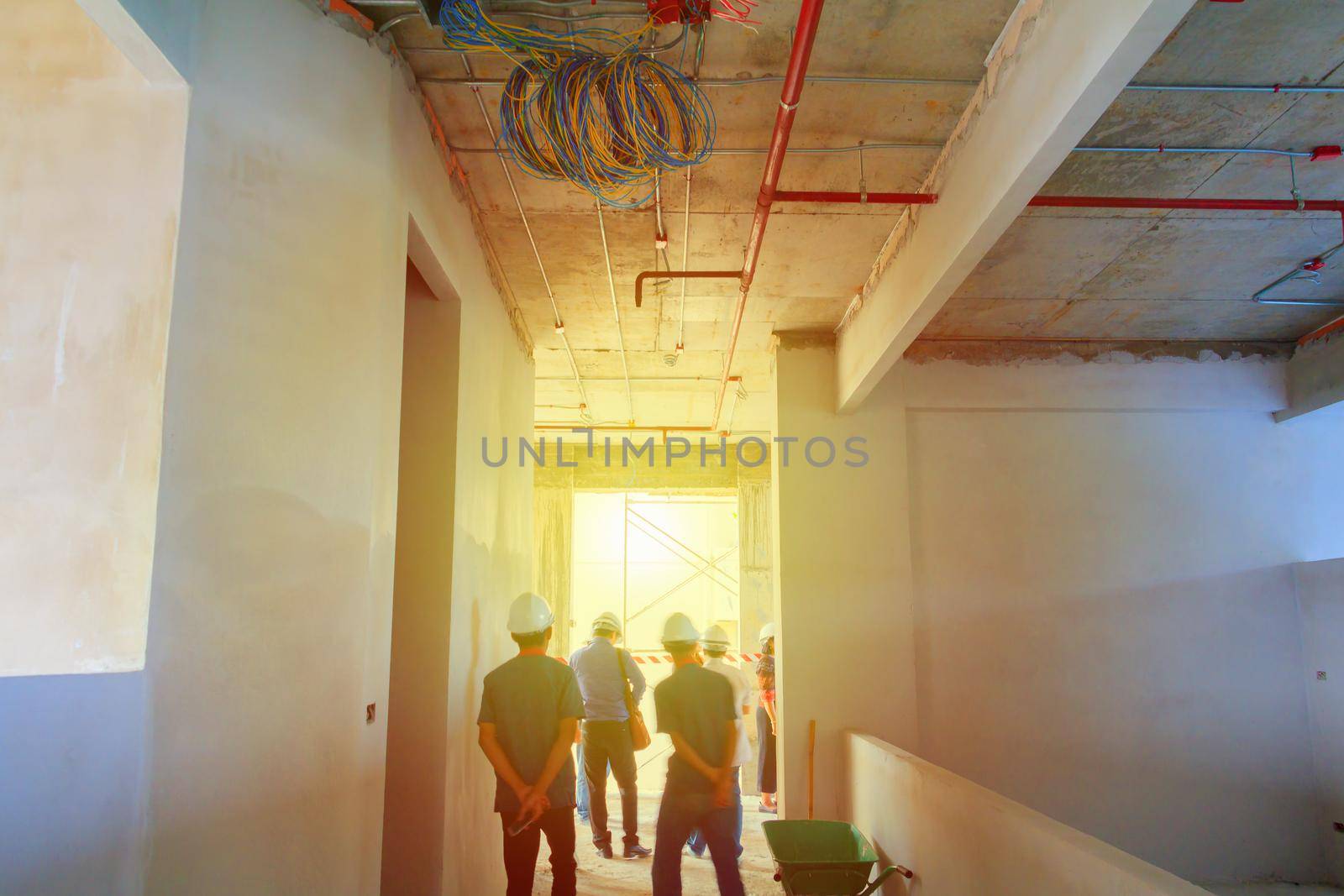 interior in construction and wall decoration at building site with engineer motion and tone light sunlight  morning by pramot