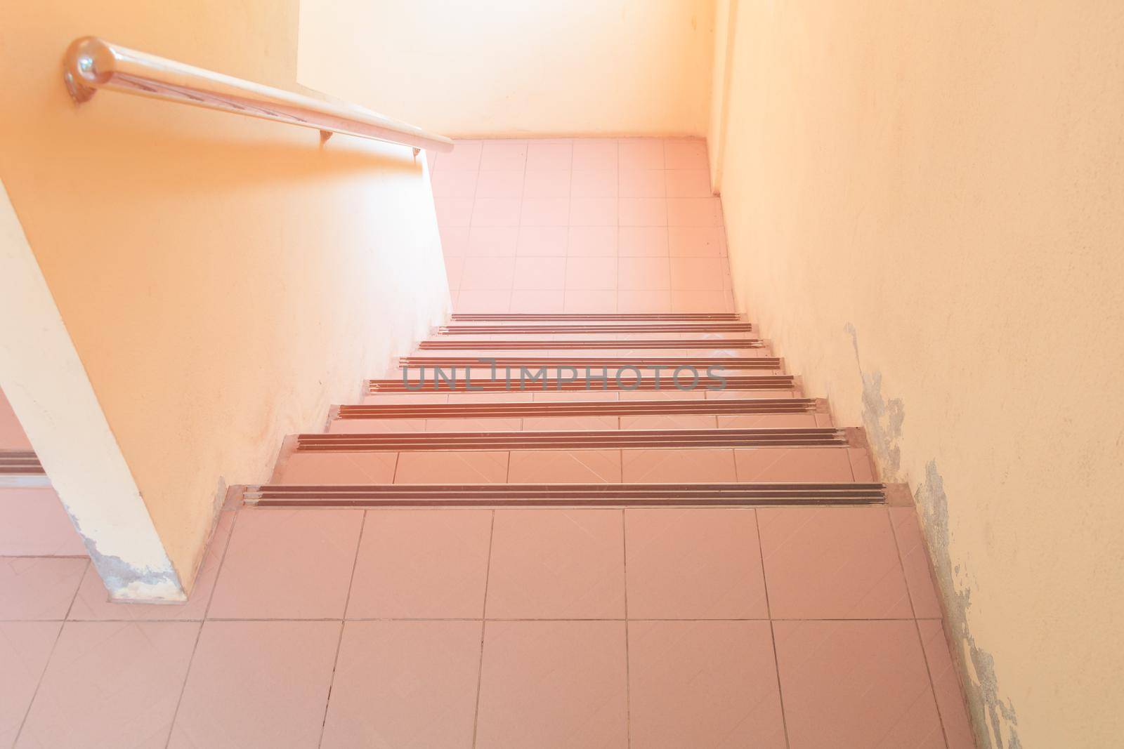 stairs walkway down terrazzo floor. select focus with shallow depth of field by pramot