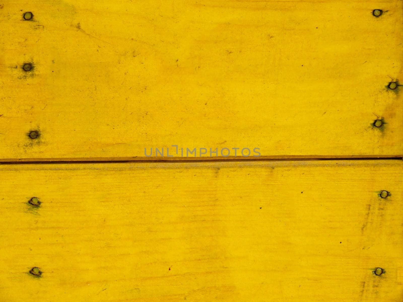 Old wooden and chipped board and painted yellow .Texture or background