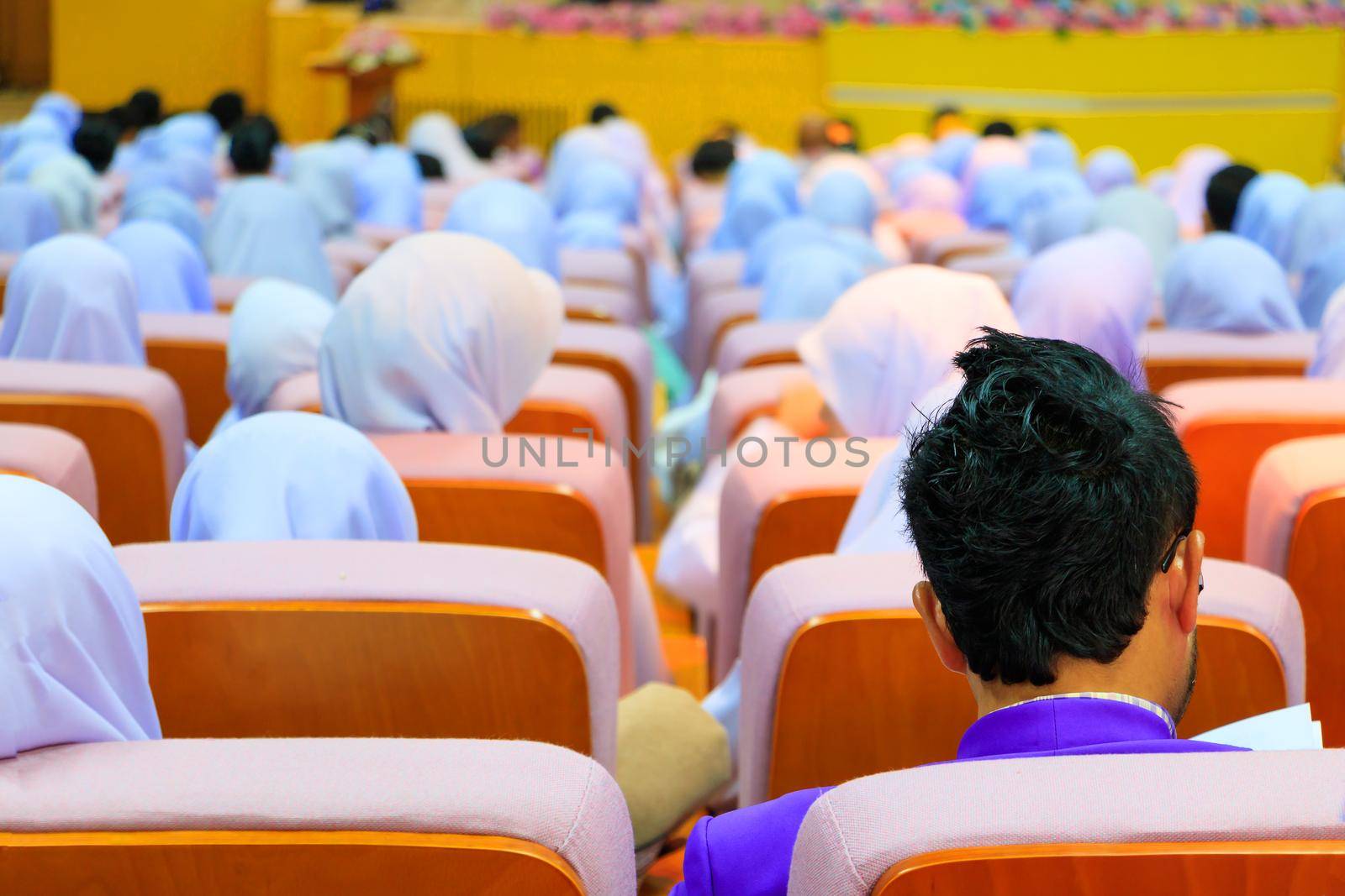 Students education sit on chair orange interior classroom learning in university