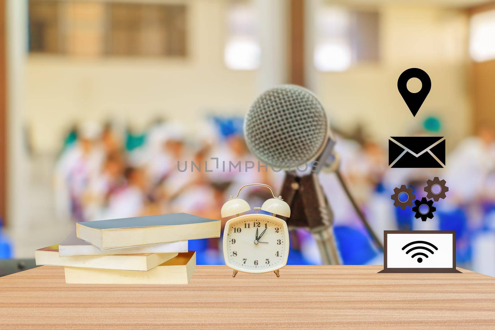 alarm clock and book and connect icon Education Network in meeting room Background blur with copy space add text