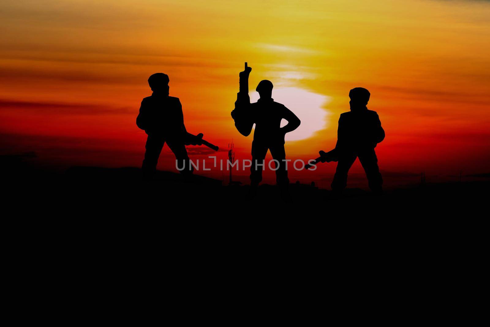 Silhouette Soldiers  with sunset and copy space add text ( Concept stop hostilities To peace) by pramot