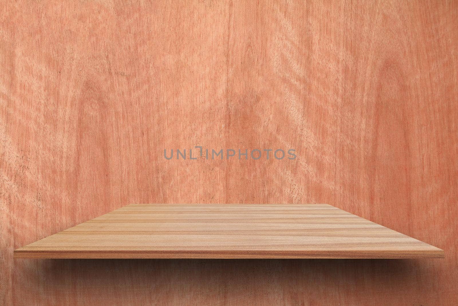 Empty top wooden shelves and woody wall background. For product display with copy space add text