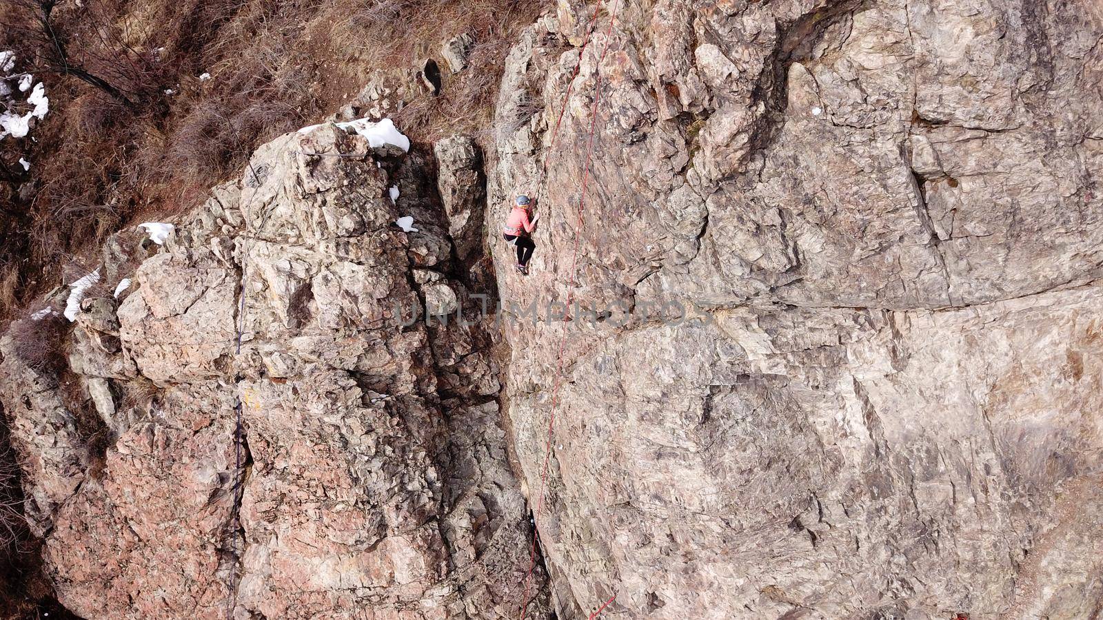 A group of people are engaged in rock climbing. by Passcal