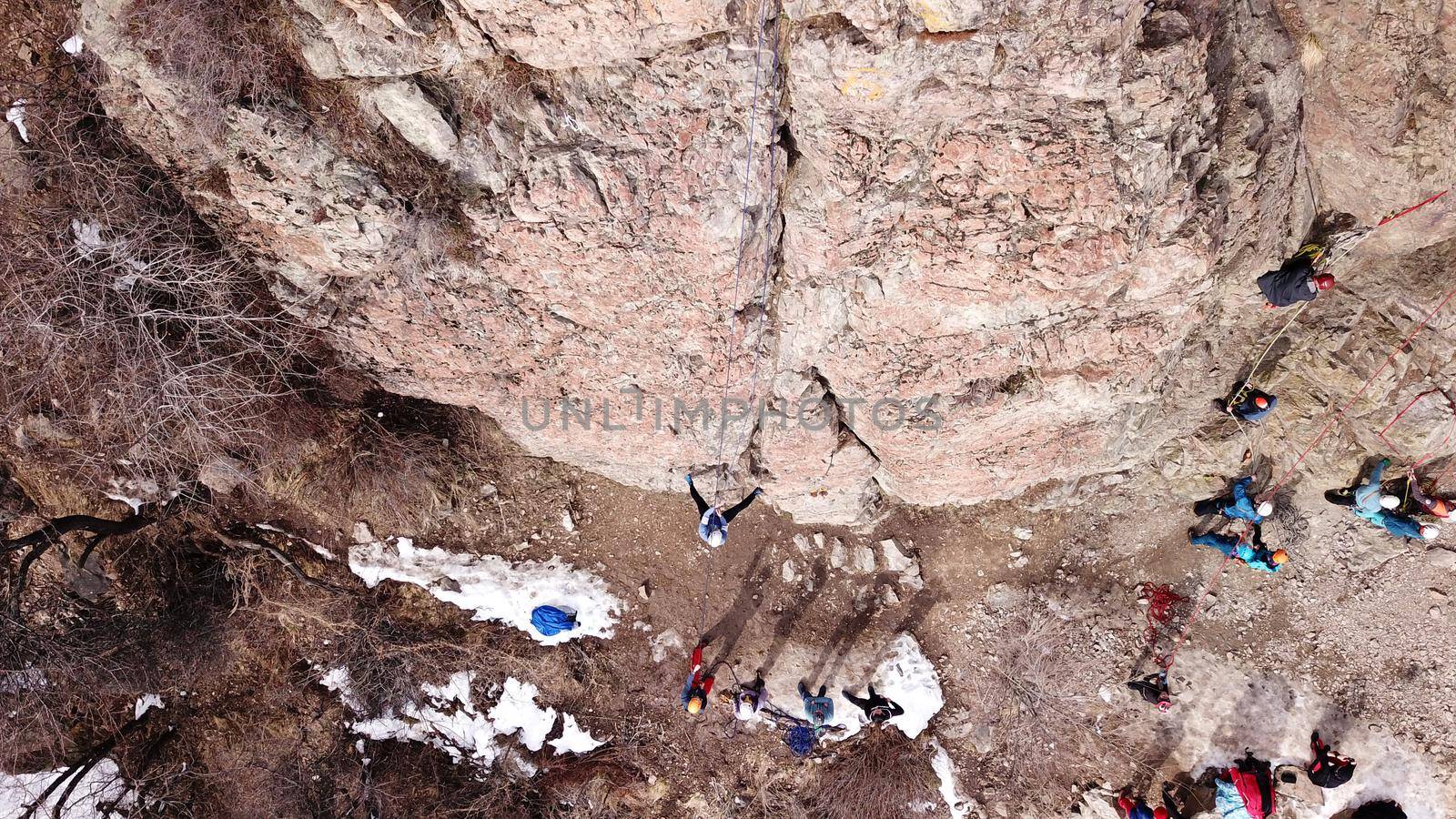 A group of people are engaged in rock climbing. by Passcal