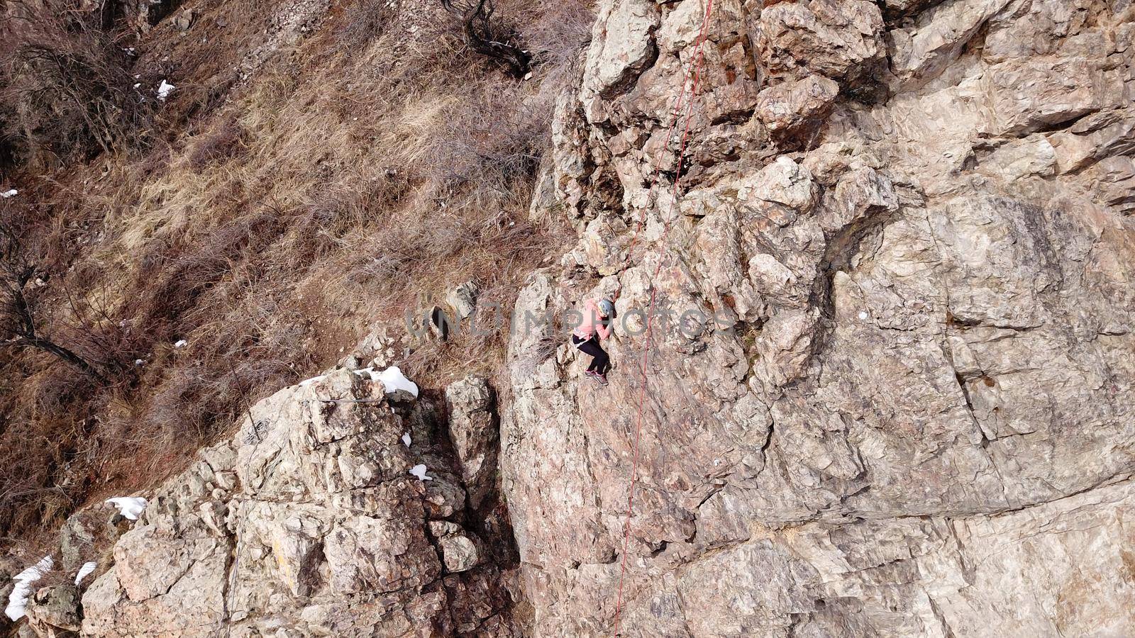 A group of people are engaged in rock climbing. by Passcal