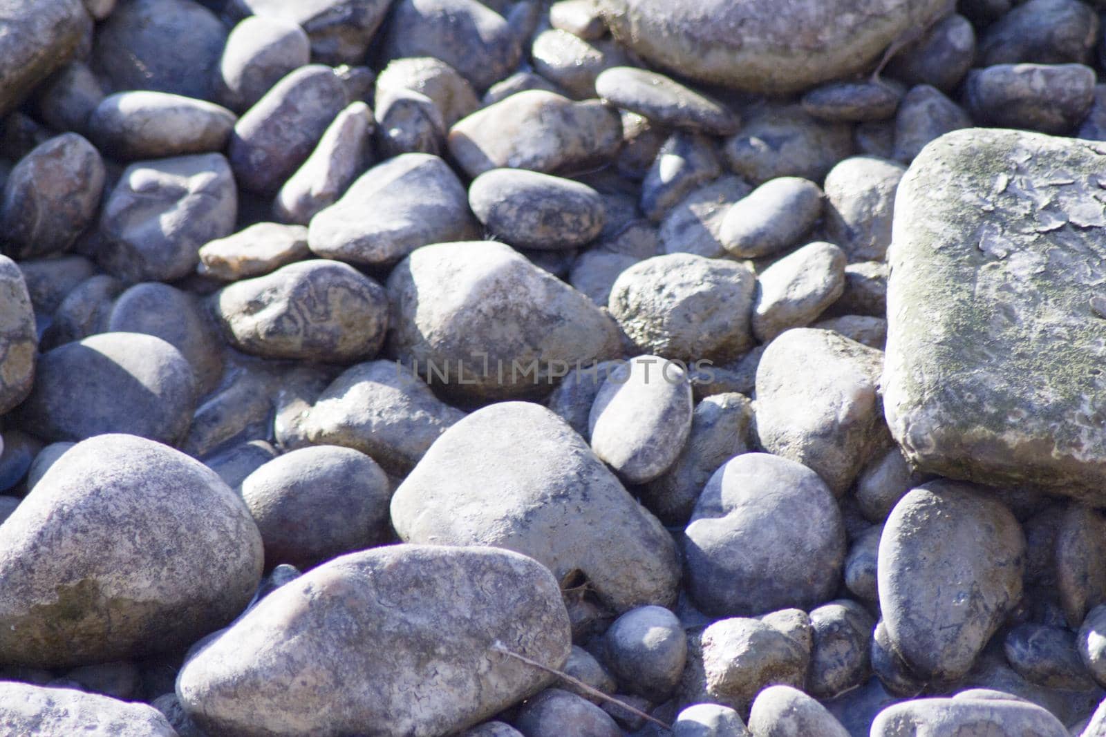 Set of natural stones on the bank of a river. No people
