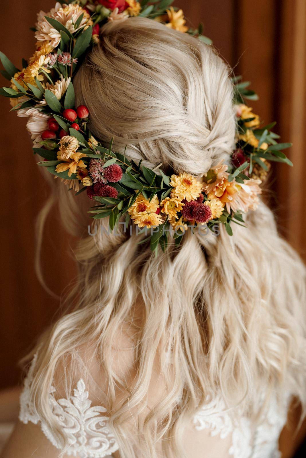 wedding wreath of dried flowers on the head of a bride with white hair