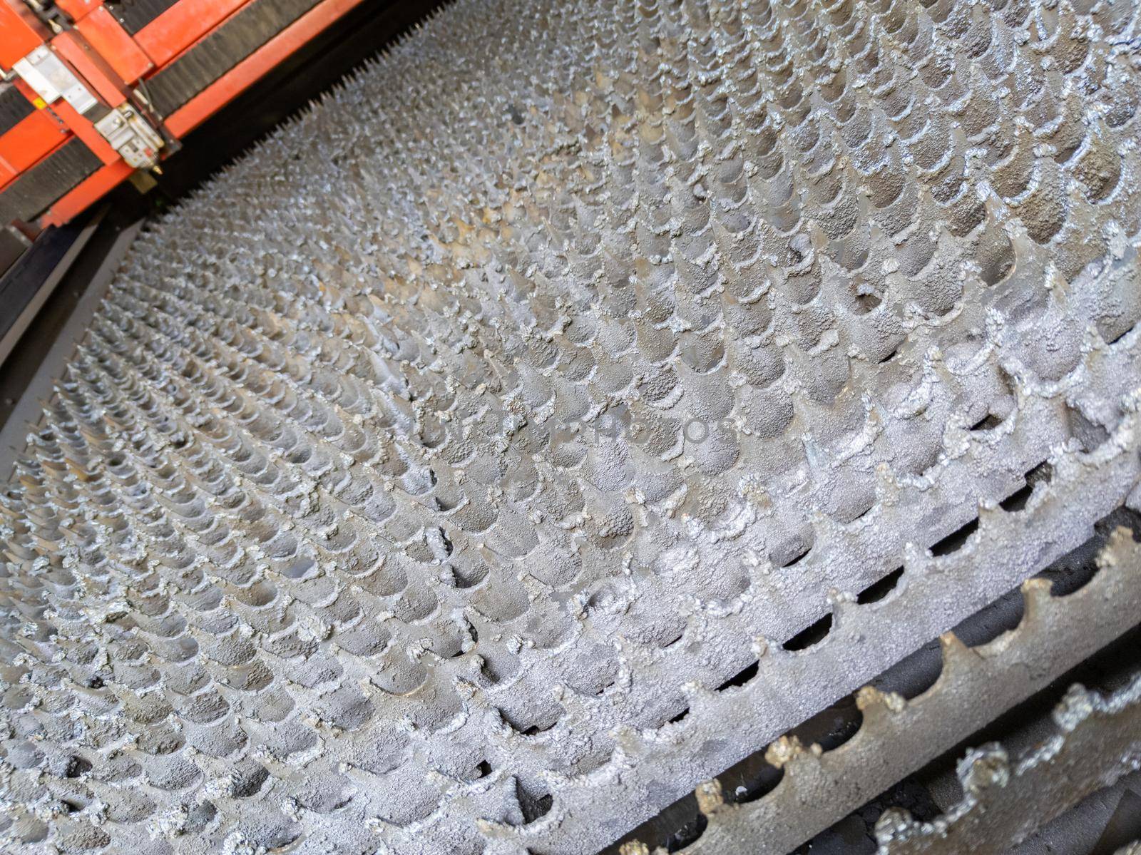 inside of empty cnc laser cutting machine - without workpiece metal sheet, only bare supporting bed slats table