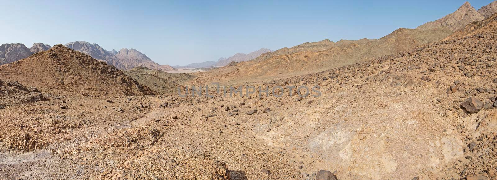 Rocky mountain slope landscape panorama in an arid desert environment
