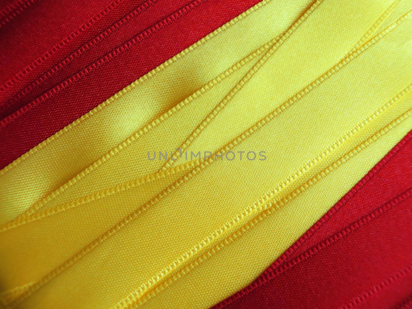 SPAIN flag or banner made with red and yellow ribbons