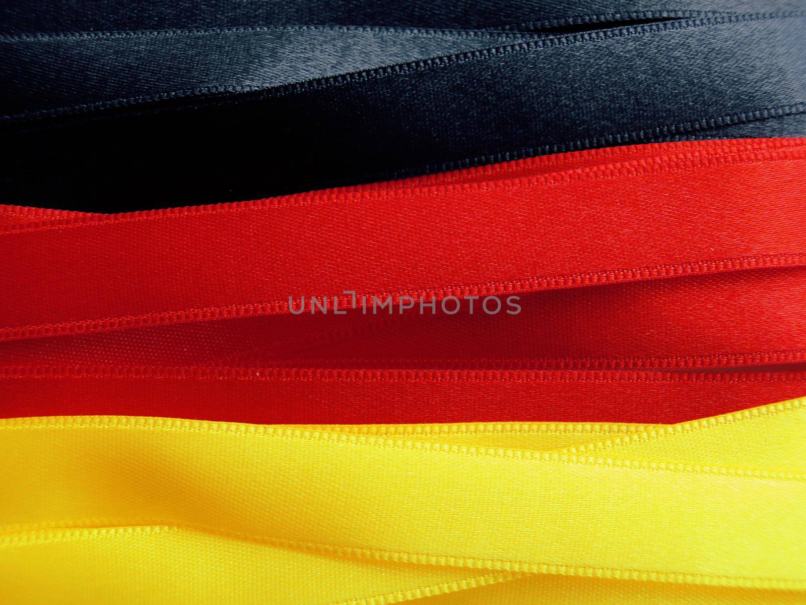 GERMANY flag or banner made with black, red and yellow ribbons