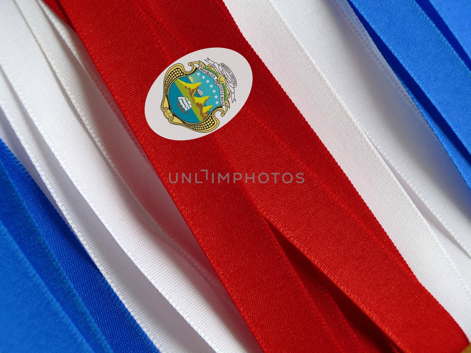 Costa Rica flag or banner made with red, blue and white ribbons