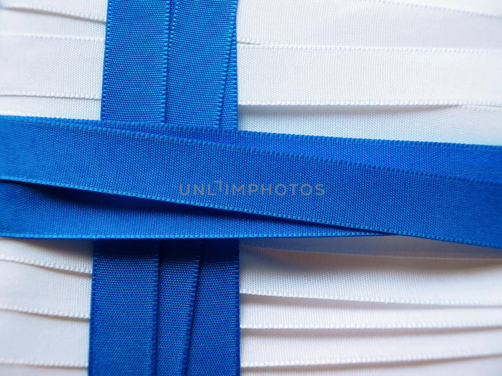 Finland flag or banner made with white and red ribbons