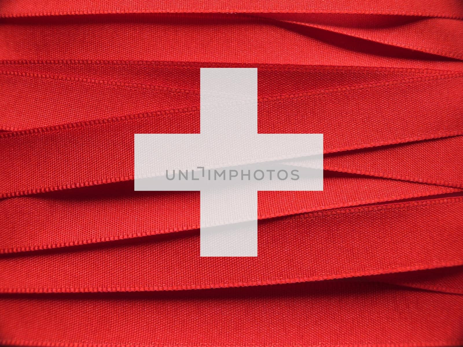 Switzerland flag or banner made with red and white ribbons