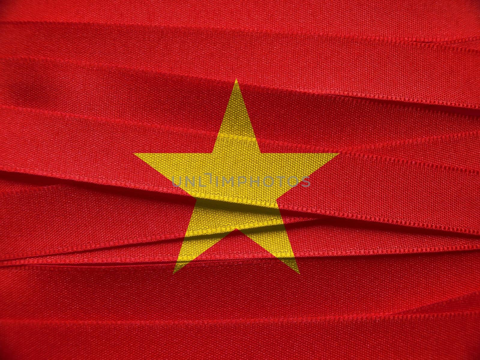 Vietnam flag or banner made with red ribbons