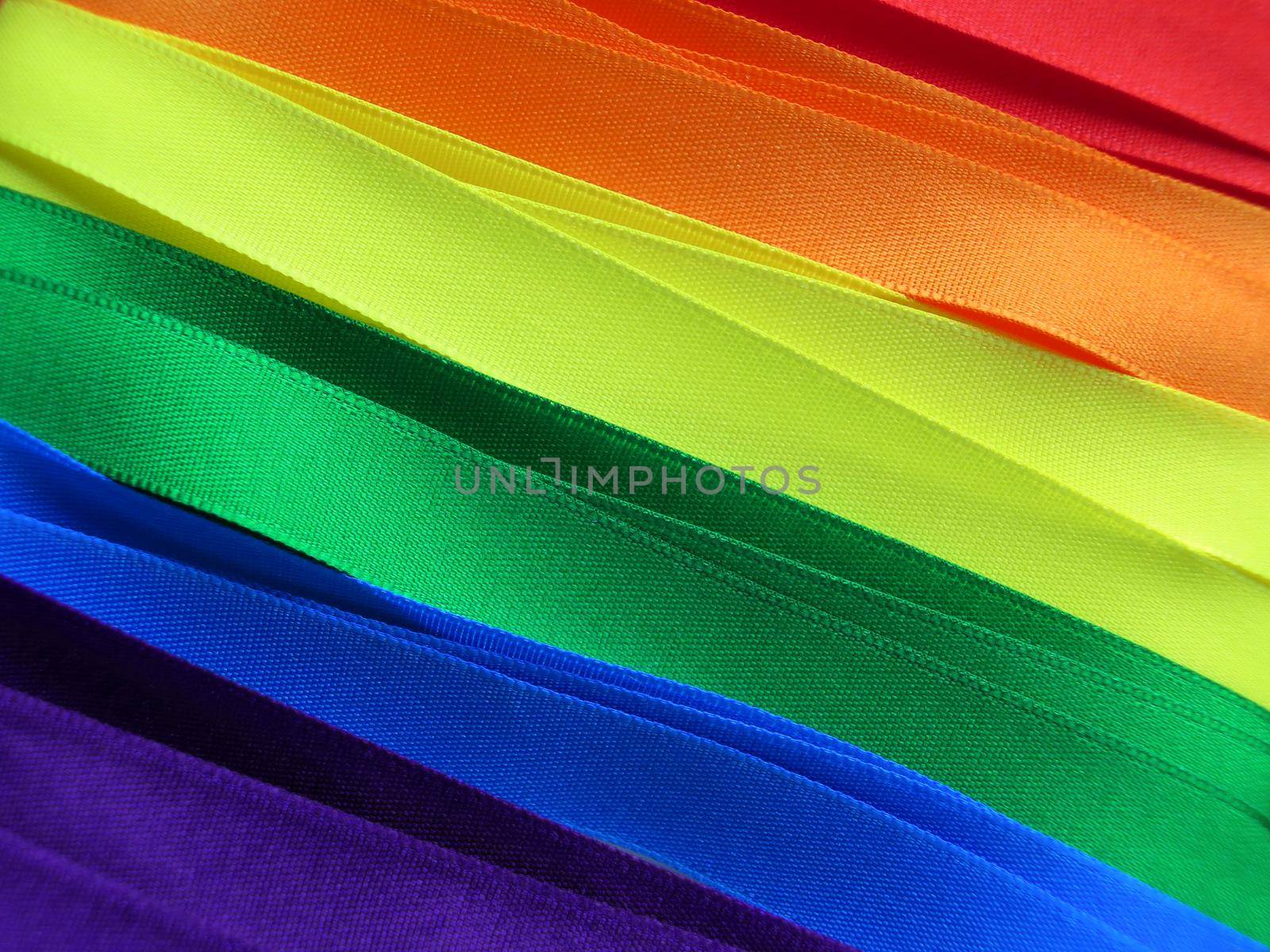 Gay Flag flag or banner made with red, orange, yellow, green, blue and purple ribbons