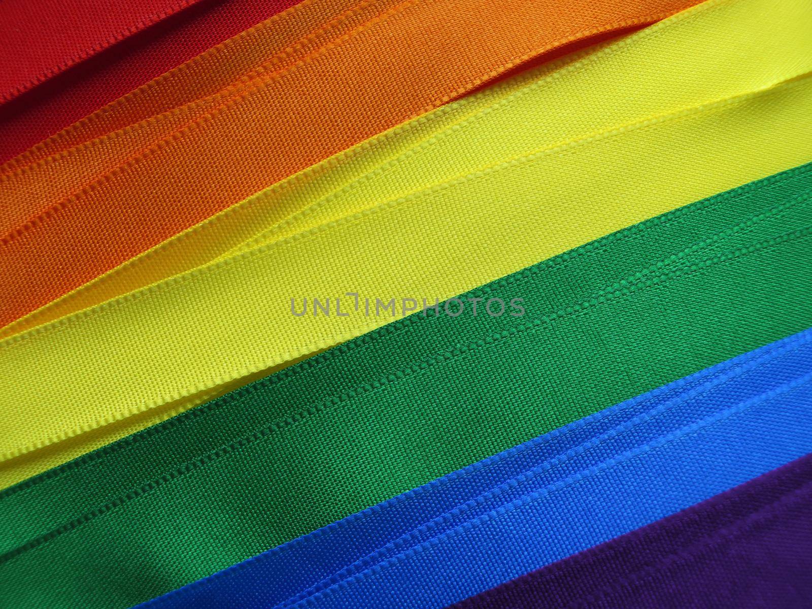 Gay Flag flag or banner made with red, orange, yellow, green, blue and purple ribbons