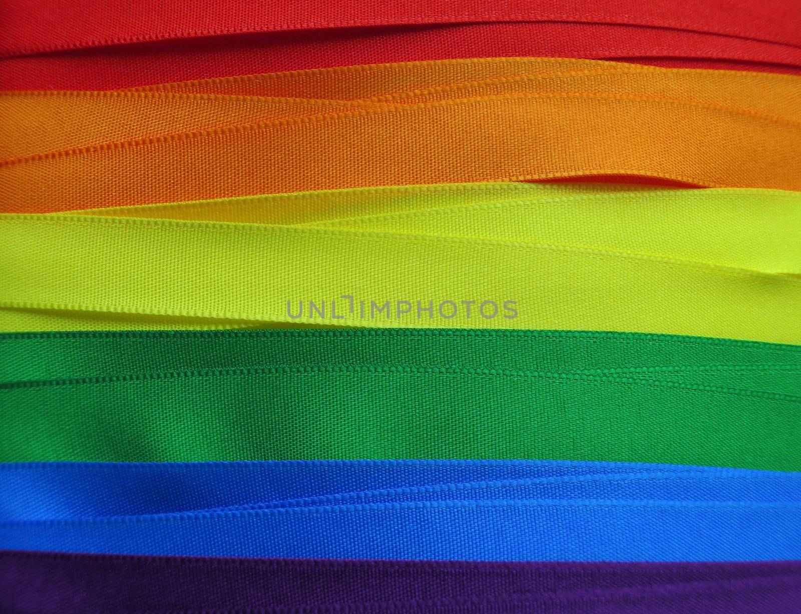 Gay Flag flag or banner made with red, orange, yellow, green, blue and purple ribbons