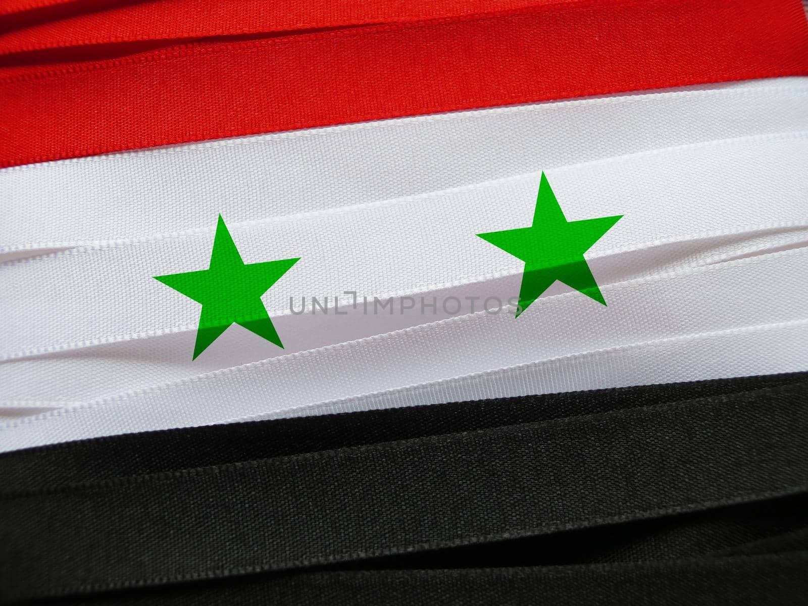 Syria flag or banner made with red, white and black ribbons