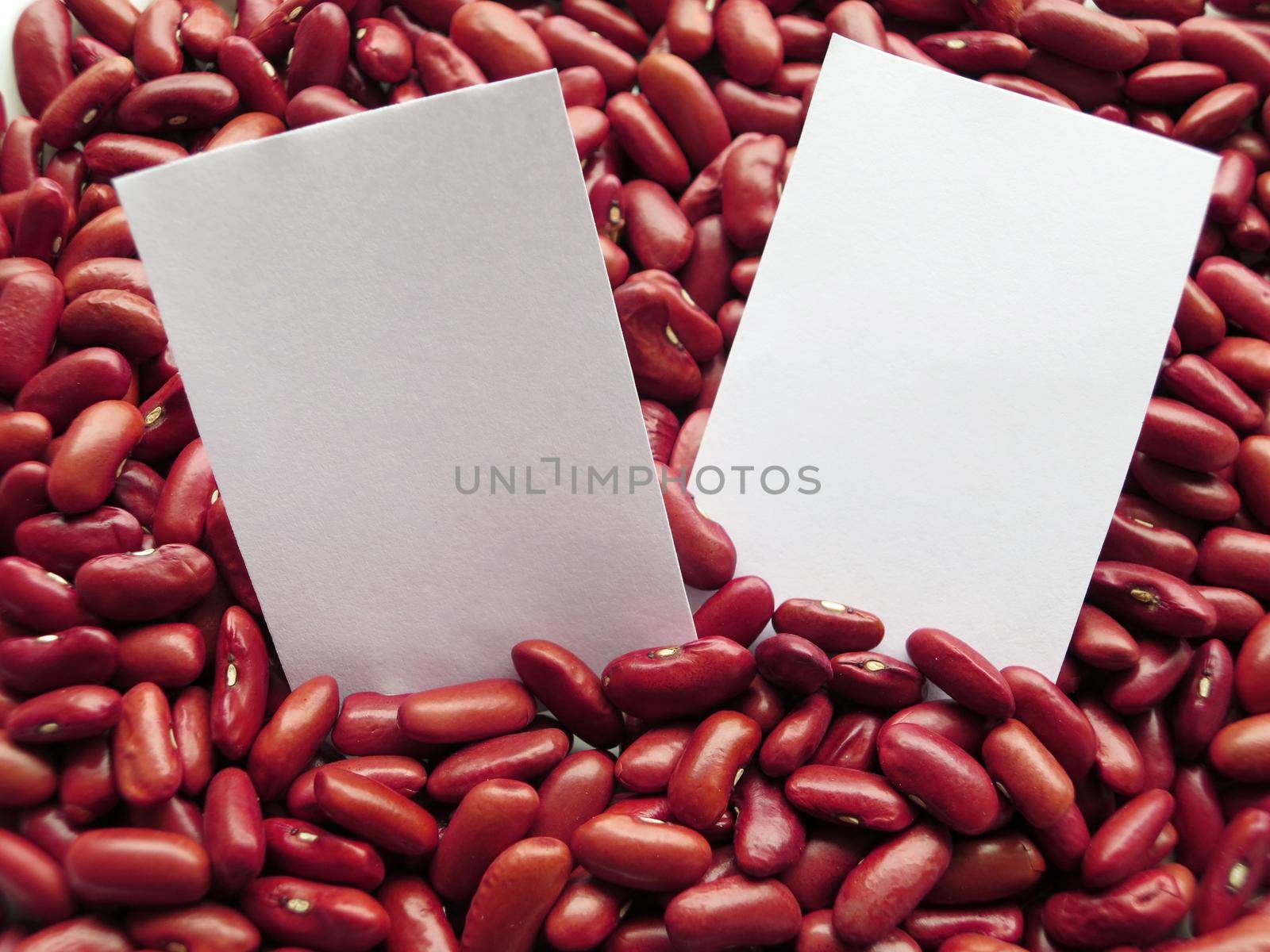 Closeup of White tag on Raw Red Kidney Beans Background by aroas