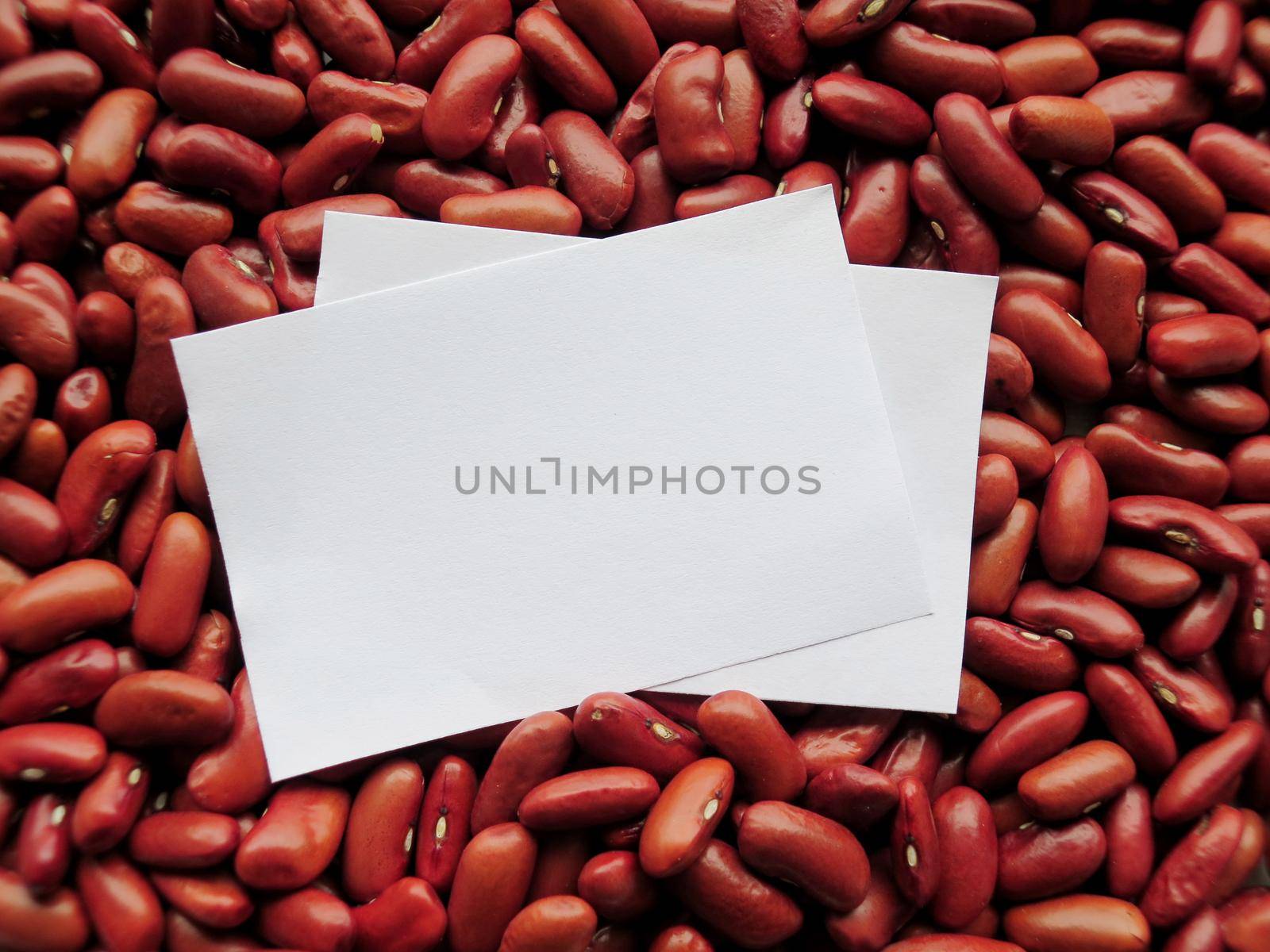 Closeup of White tag on Raw Red Kidney Beans Background by aroas