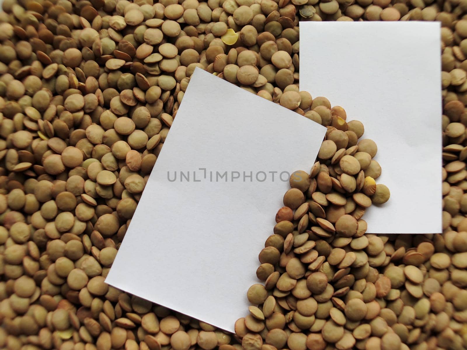 Closeup of White tag on raw lentils background by aroas