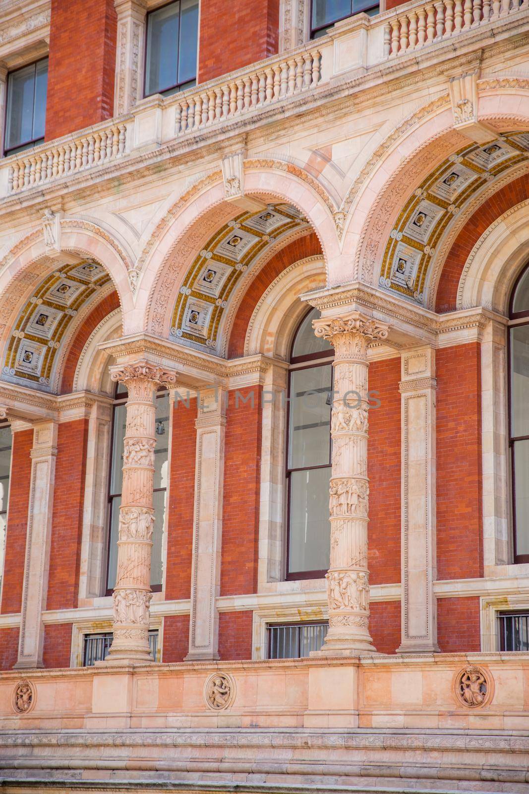Majestic columns and arches with classic design of Victoria and Albert Museum. Beautiful British building with Victorian architecture. Arts and museums