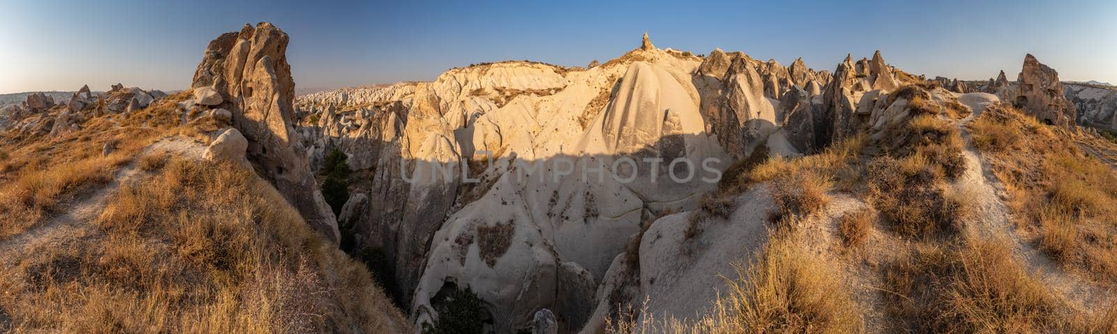 The picturesque panorama of Cappadocia at sunset, amazing Turkey, Mountains and rock formation, big size image, Goreme national park, Love valley, open air museum, ancient region of Anatolia, Unesco by vladimirdrozdin