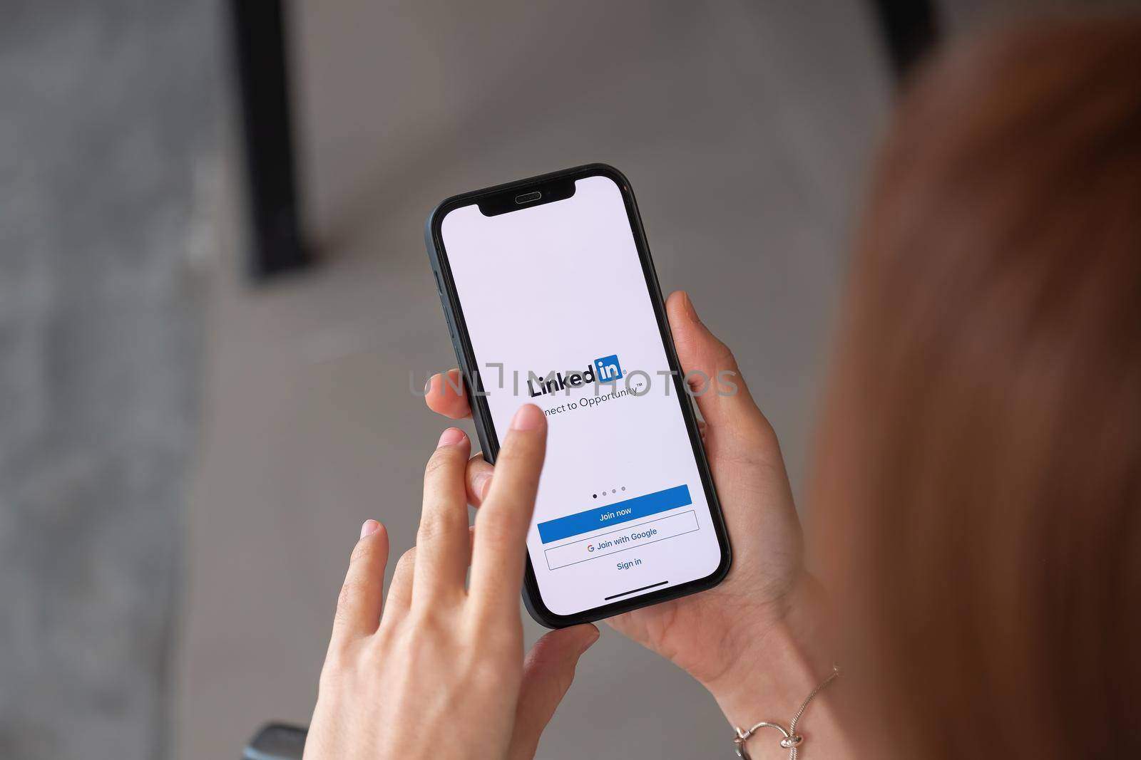 CHIANG MAI, THAILAND - APR 4, 2021: iPhone 12 with LinkedIn application on the screen. LinkedIn is a business-oriented social networking service.